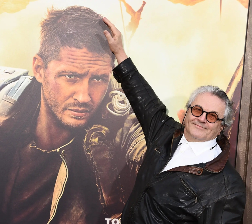 George Miller with Mad Max: Fury Road poster
